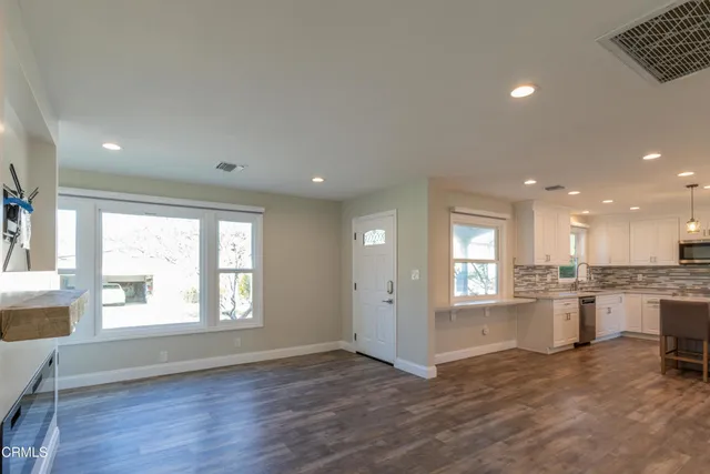 a view of a kitchen cabinets and wooden floor
