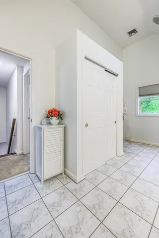 a view of a storage & utility room with a sink