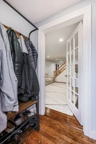 a view of walk in closet with clothes and shoes
