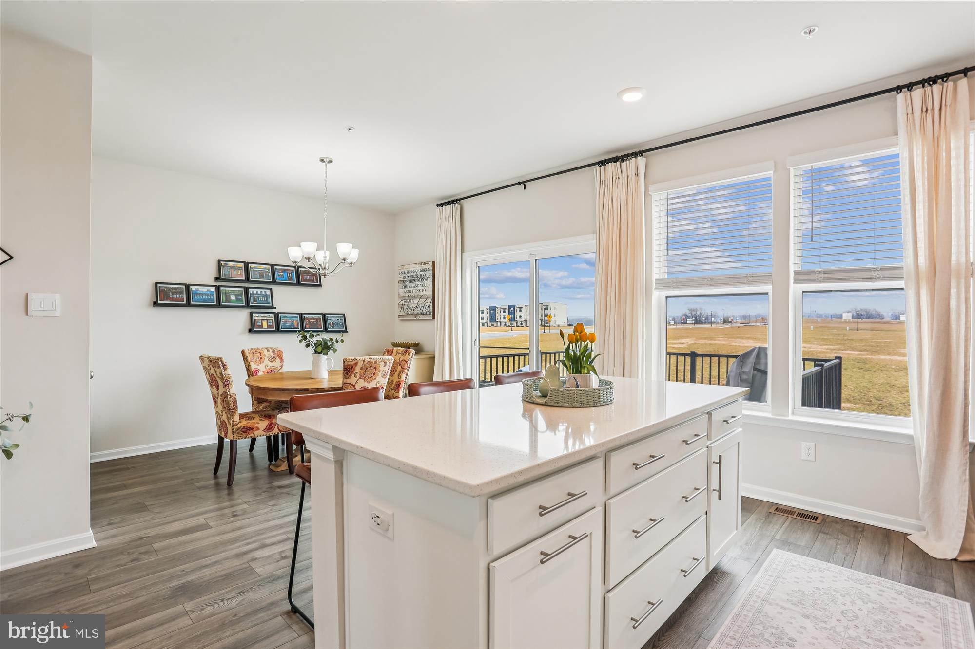 484 Tiller Street Frederick, MD 21701 - Photo 14 of 44 a kitchen with a stove a refrigerator and a dining table