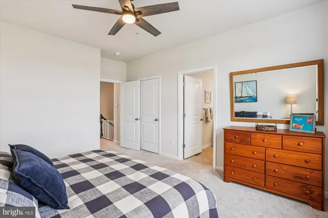 a bedroom with a bed and a dresser