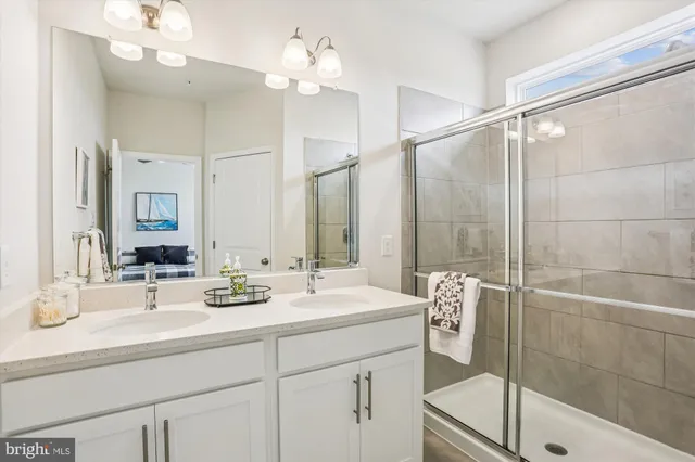 a bathroom with a double vanity sink mirror and double
