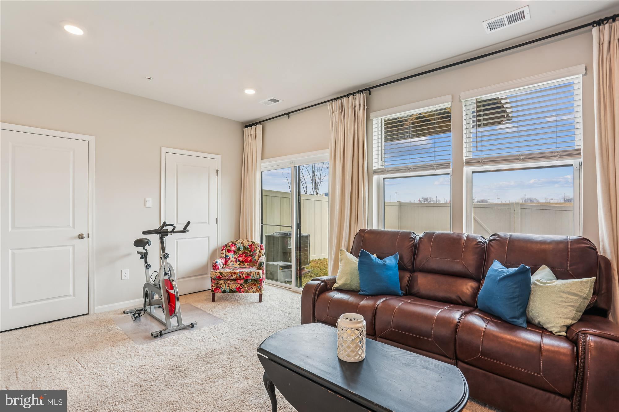 484 Tiller Street Frederick, MD 21701 - Photo 28 of 44 a living room with furniture and floor to ceiling windows