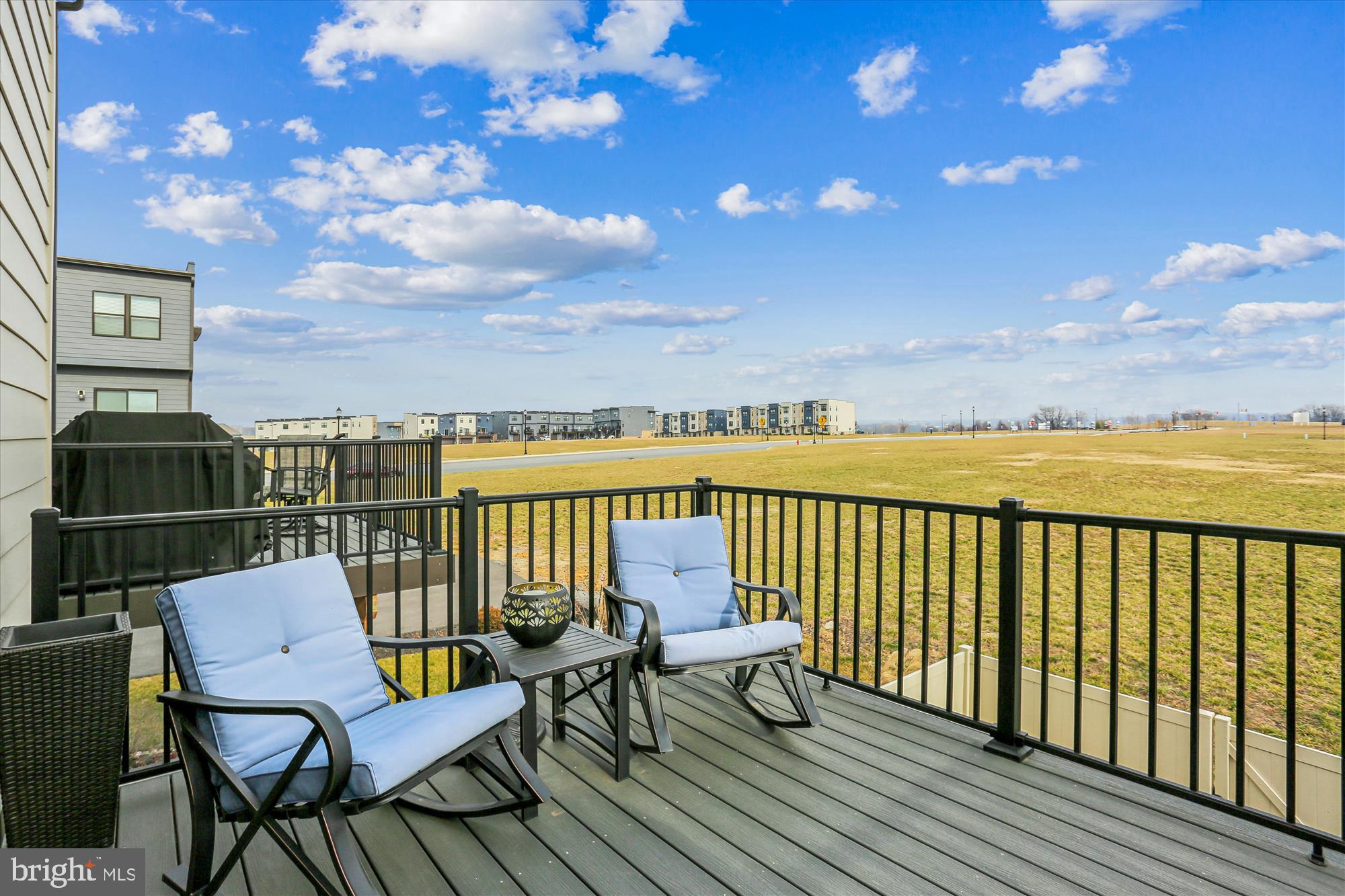 484 Tiller Street Frederick, MD 21701 - Photo 3 of 44 a balcony with wooden floor and city view