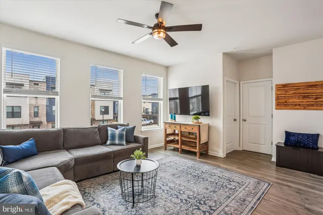 a living room with furniture and a rug
