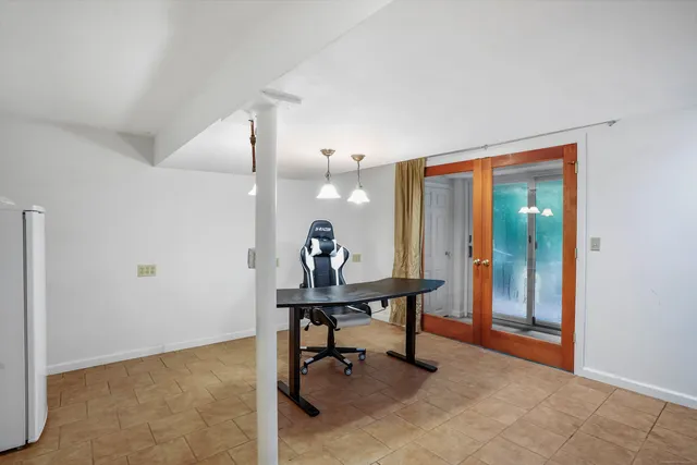 a view of a workspace with furniture