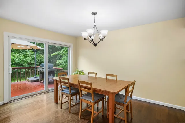 a view of a dining room with furniture window and outside view