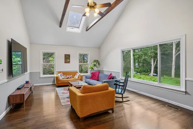 a living room with furniture and a large window