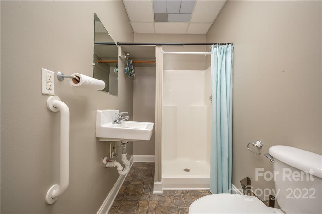 406 Daniel Road Spindale, NC 28160 - Photo 23 of 33 a bathroom with a sink a toilet and shower