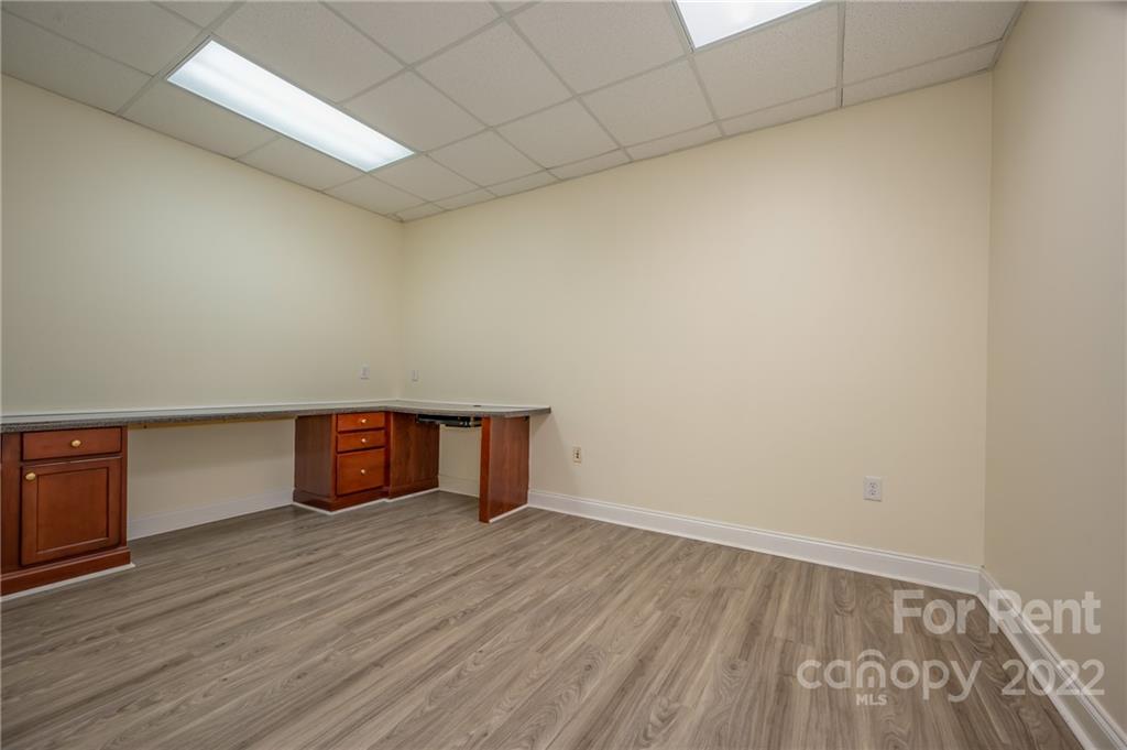 406 Daniel Road Spindale, NC 28160 - Photo 32 of 33 a room with wooden floor and cabinets