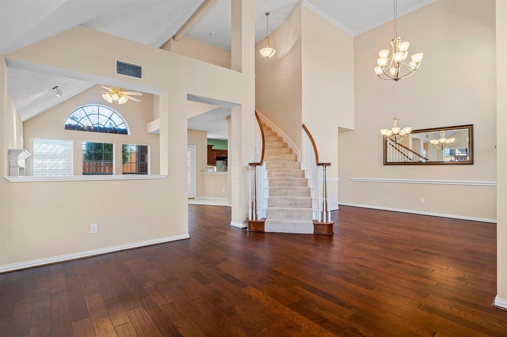 14588 Poe Court Addison, TX 75001 - Photo 6 of 28 a view of empty room with wooden floor and fan