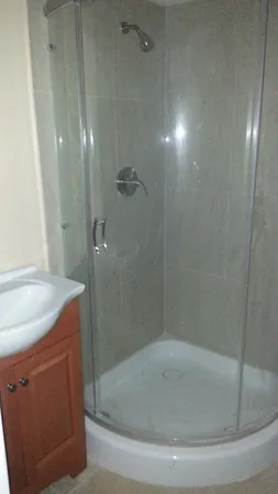 a bath tub sitting next to a shower