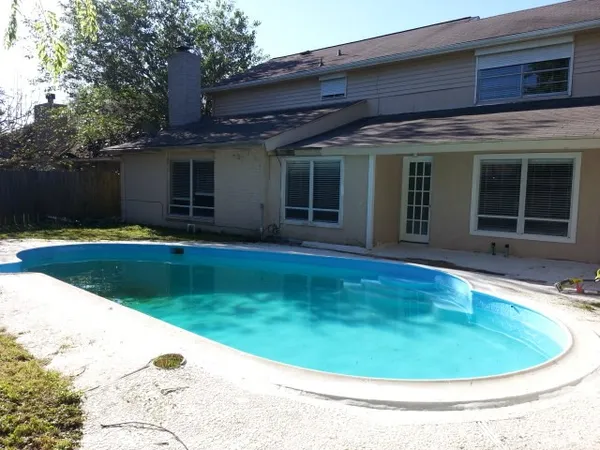 a view of a house with swimming pool
