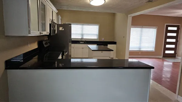 a kitchen with a sink and a window