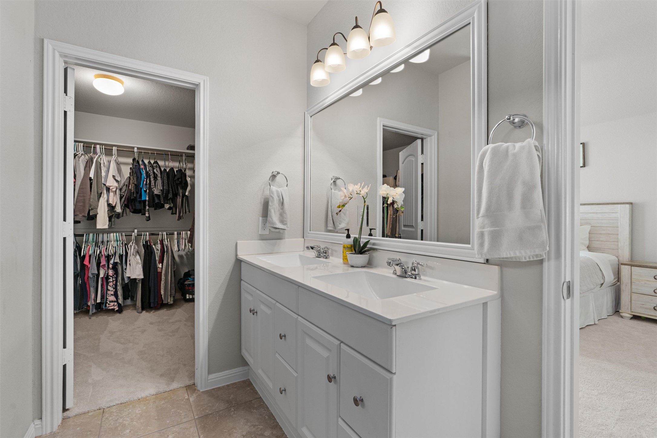 524 Longhorn Cavern Road Leander, TX 78641 - Photo 18 of 34 Ensuite bathroom with double vanity, and a walk in closet