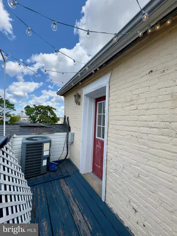 a view of a balcony with wooden floor