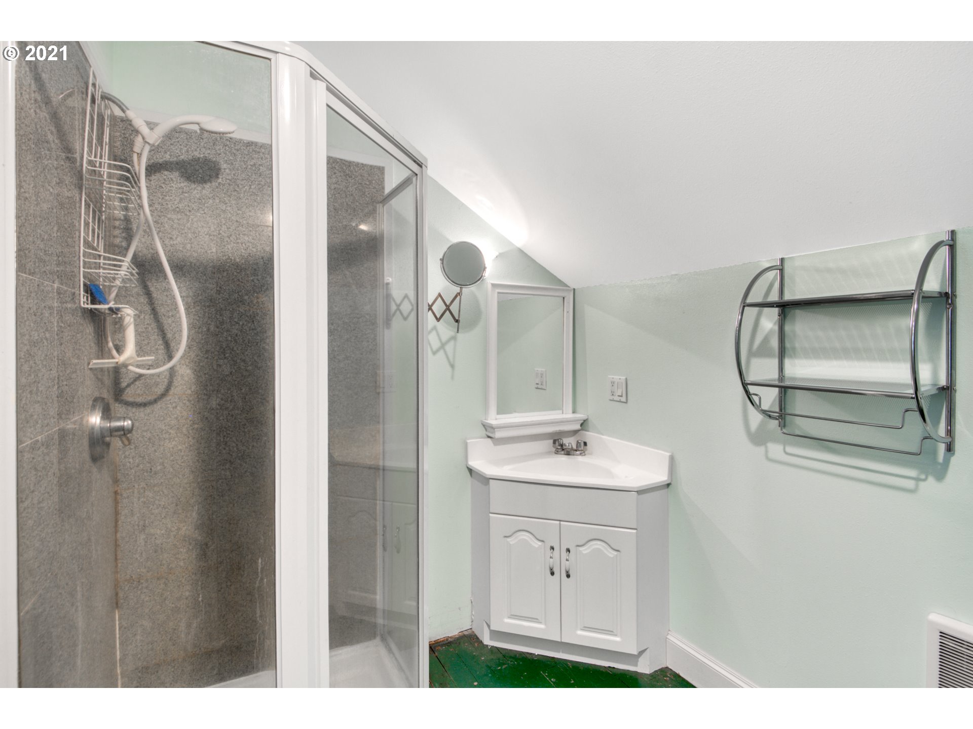 10921 Arndt Road Northeast Aurora, OR 97002 - Photo 22 of 29 a bathroom with a sink mirror and shower