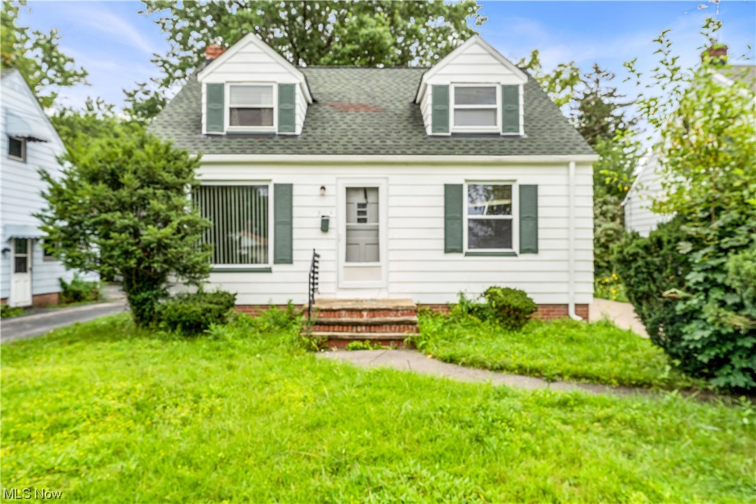 5619 Dunham Road Maple Heights, OH 44137 - Photo 1 of 19 Cape cod-style house featuring a front lawn