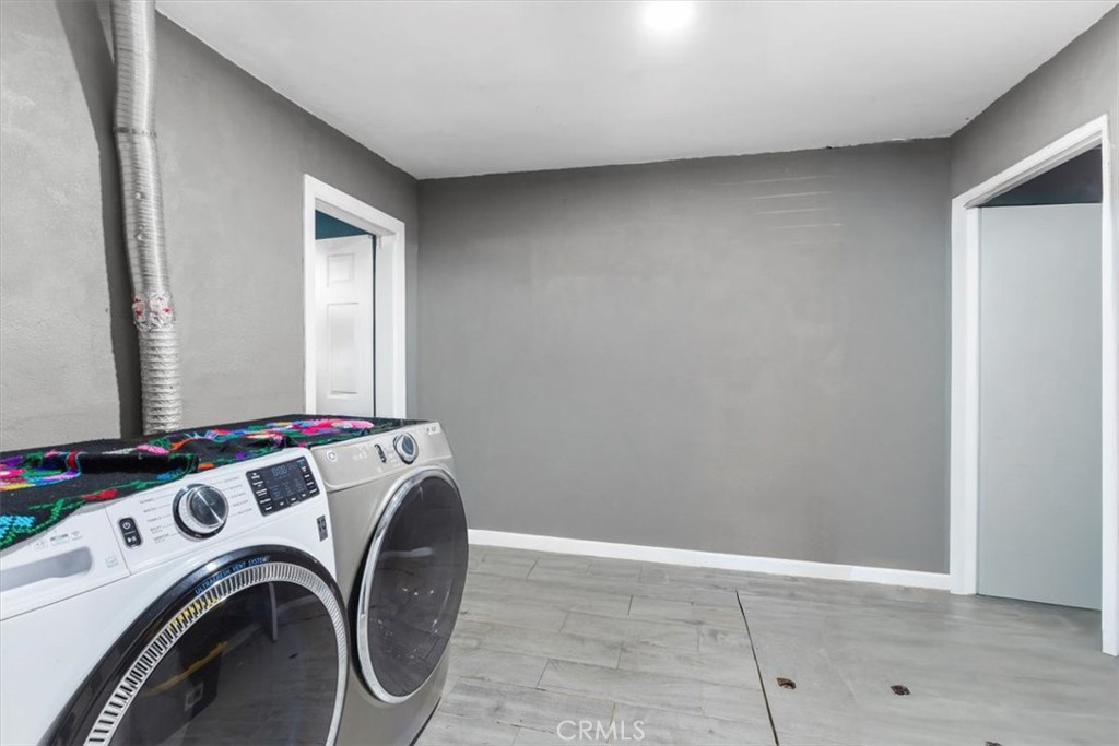 3715 South Neece Street Corona, CA 92879 - Photo 12 of 20 a view of storage and utility room with washer and dryer