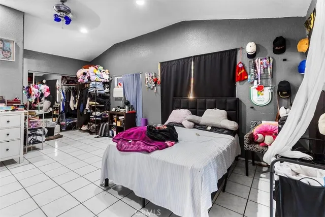 a bedroom with a bed and a closet