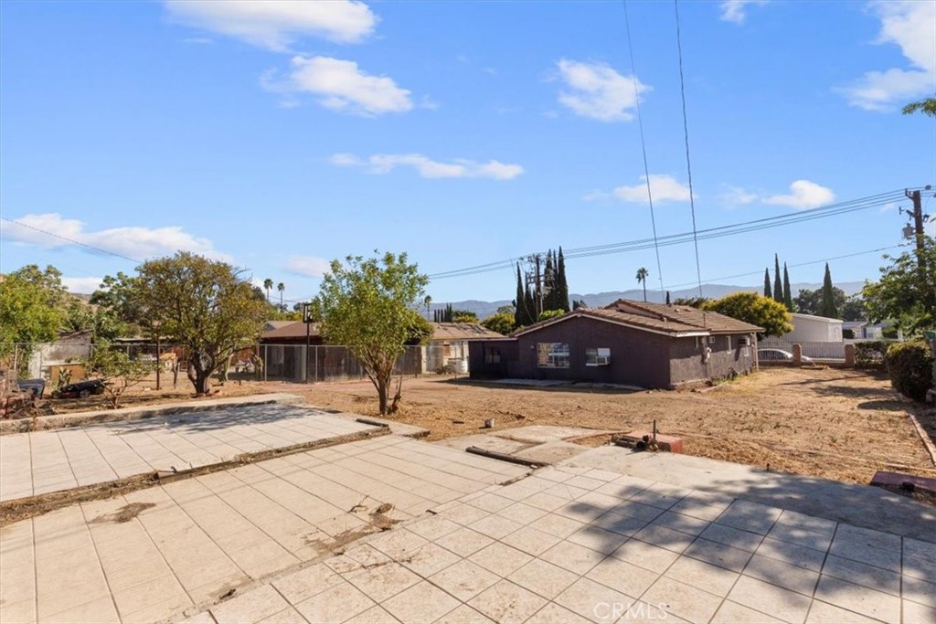 3715 South Neece Street Corona, CA 92879 - Photo 19 of 20 a front view of a house with a yard and car parked