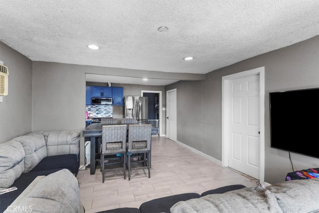 3715 South Neece Street Corona, CA 92879 - Photo 4 of 20 a living room with furniture and a flat screen tv