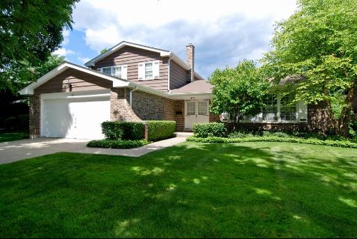 755 Sumac Road Highland Park, IL 60035 - Photo 1 of 1 a front view of a house with a garden