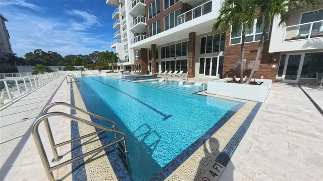 a view of a patio with a table and chairs