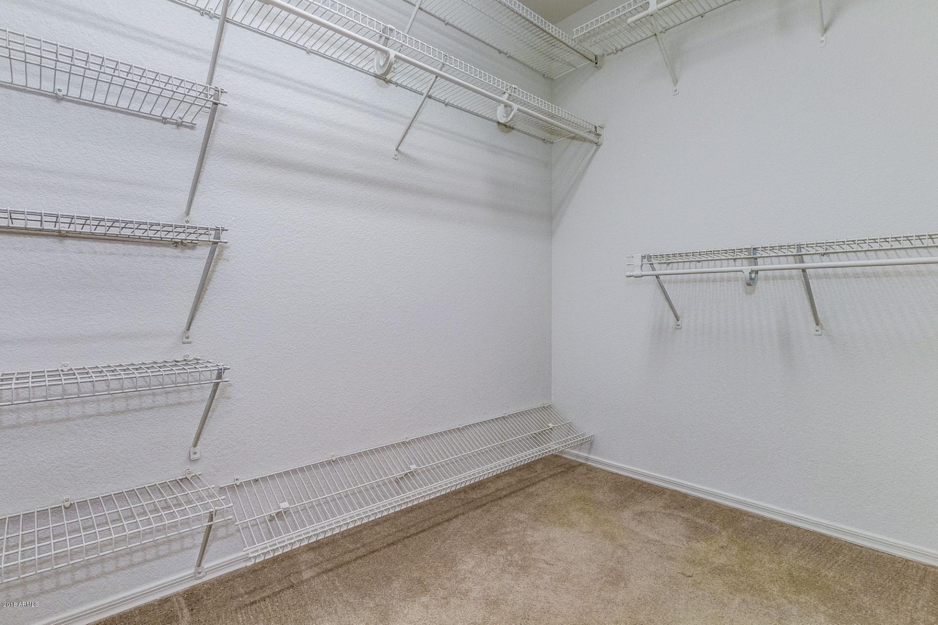 2129 West Carson Road Phoenix, AZ 85041 - Photo 18 of 22 a view of a room with racks on the wall