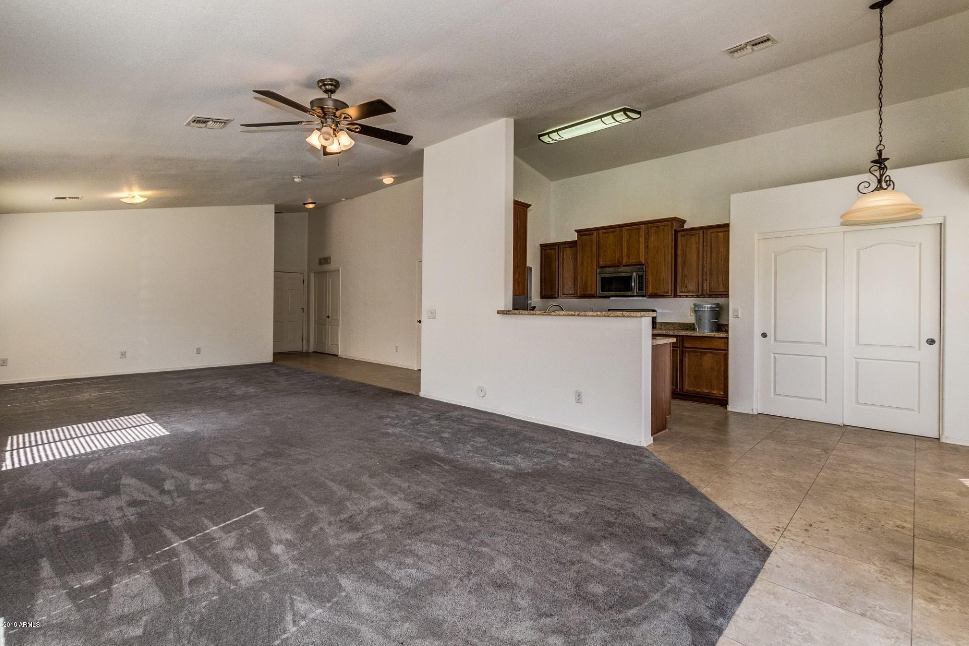 2129 West Carson Road Phoenix, AZ 85041 - Photo 2 of 22 a view of a kitchen with a sink and a refrigerator