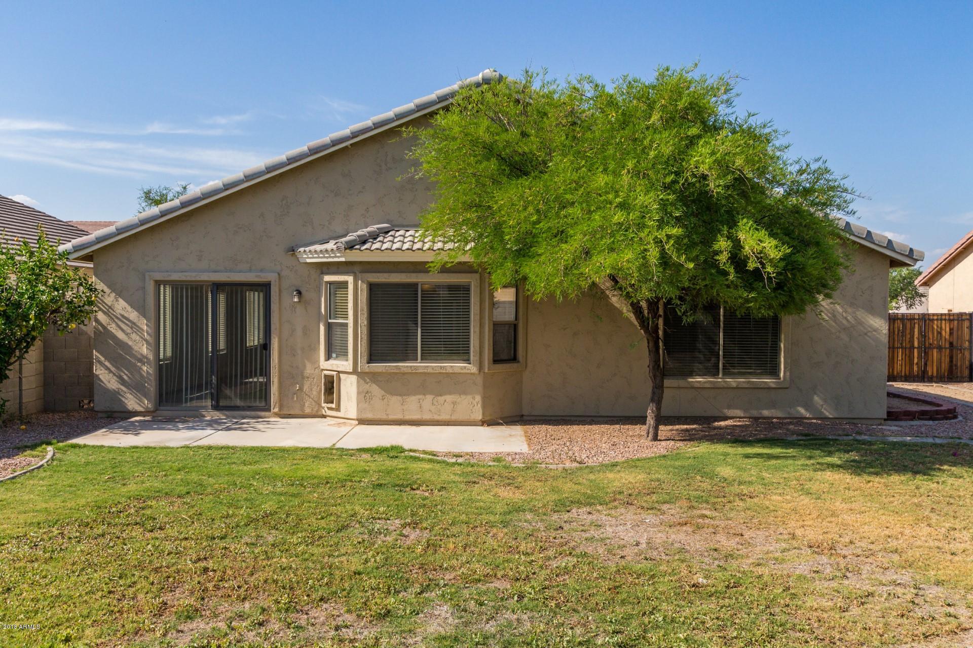 2129 West Carson Road Phoenix, AZ 85041 - Photo 22 of 22 a front view of a house with a yard