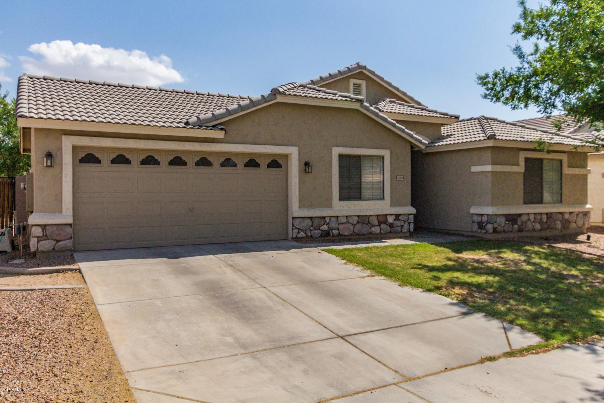 2129 West Carson Road Phoenix, AZ 85041 - Photo 5 of 22 a front view of a house with yard