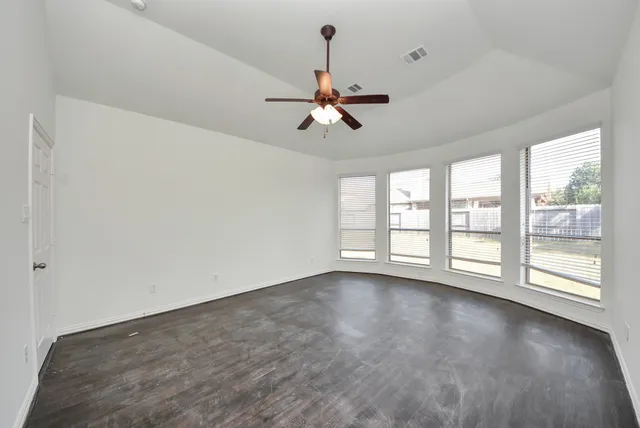 a view of an empty room with a window