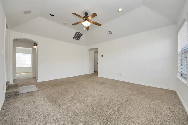 a view of a ceiling fan and a ceiling fan in a room