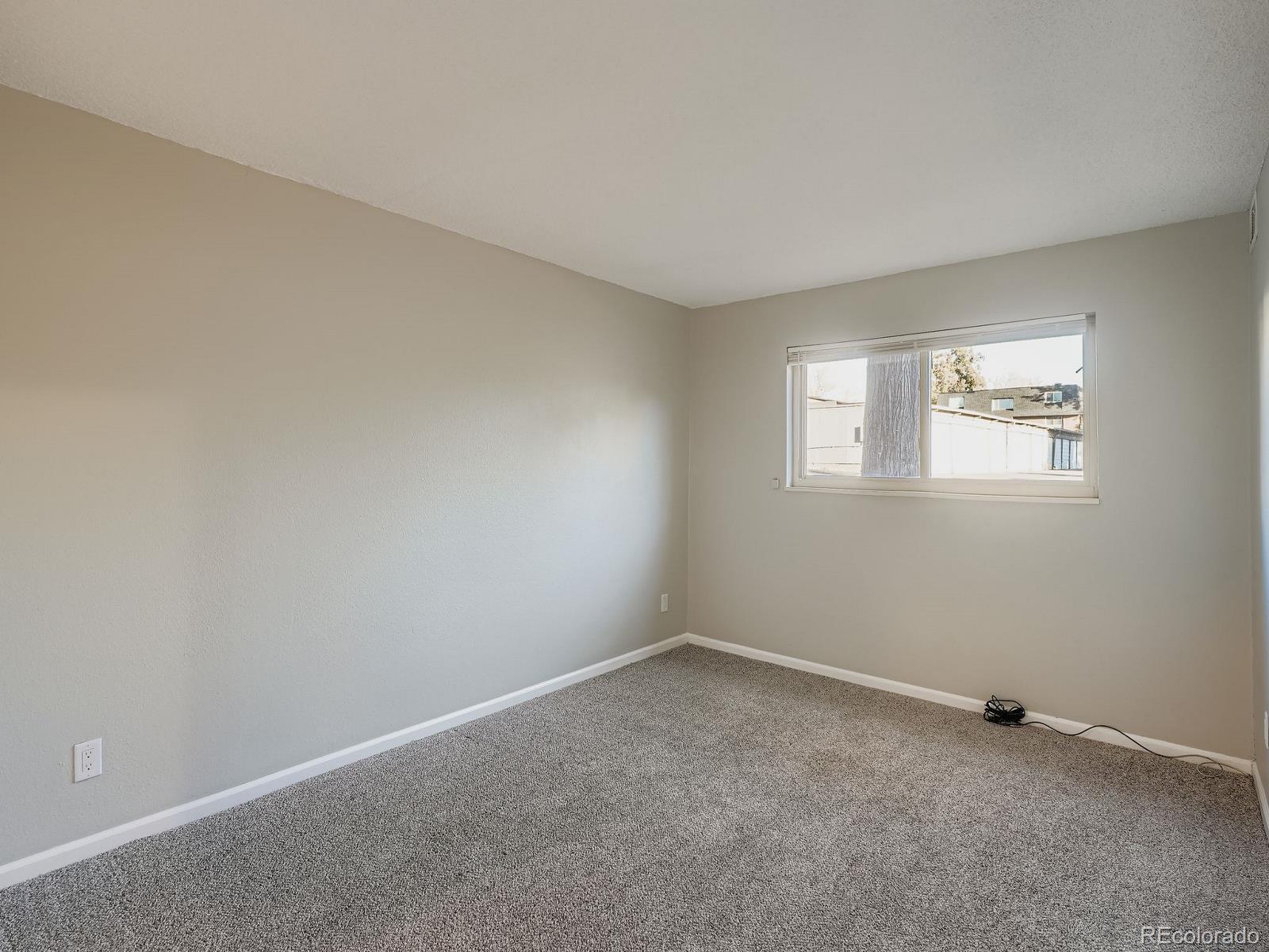 140 East Highline Circle, Unit 105 Centennial, CO 80122 - Photo 13 of 29 an empty room with windows