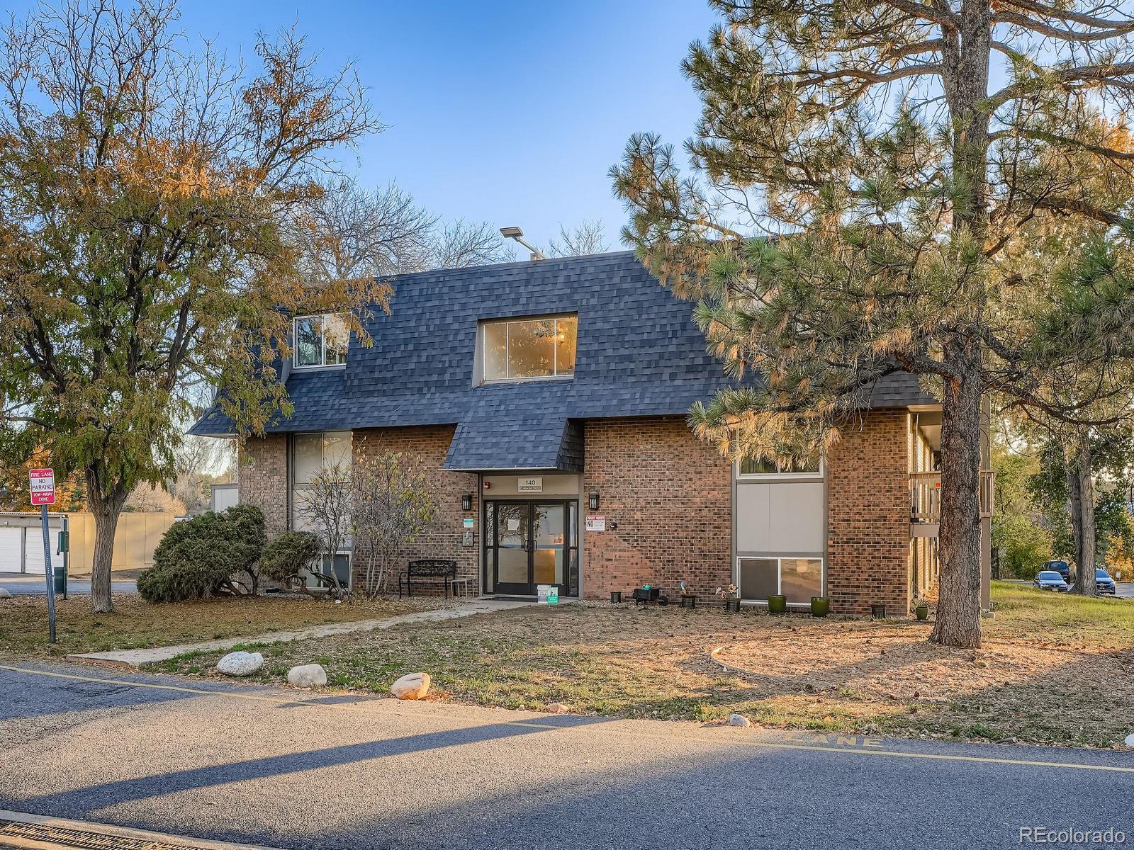 140 East Highline Circle, Unit 105 Centennial, CO 80122 - Photo 16 of 29 a house that has a tree in front of it