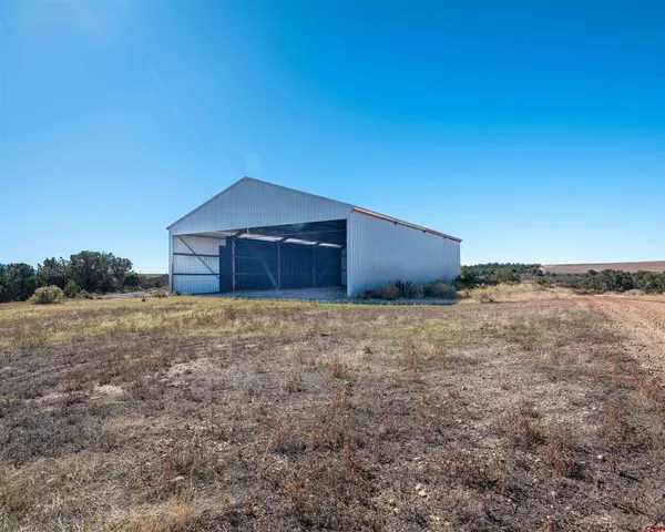 a house with trees in the background