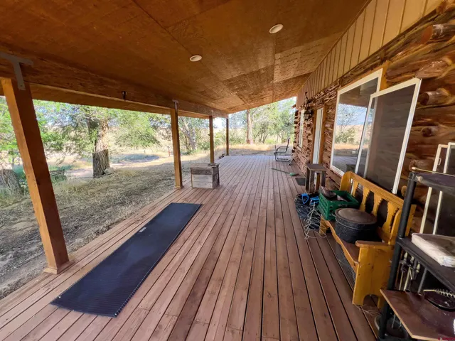 a view of porch with wooden floor