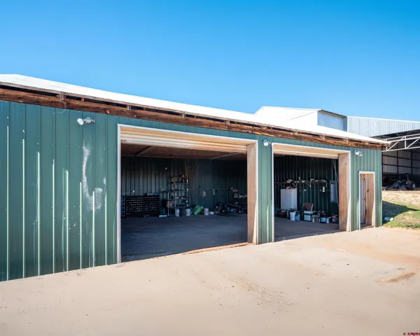 a view of a chair and table in front of a house