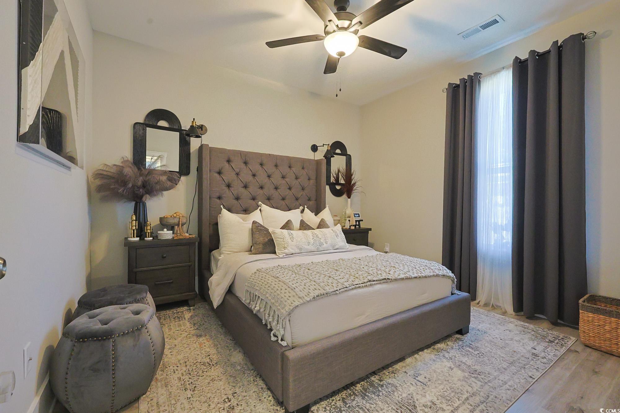 669 Pacific Commons Drive Surfside Beach, SC 29575 - Photo 20 of 36 Bedroom featuring ceiling fan and wood finished floors
