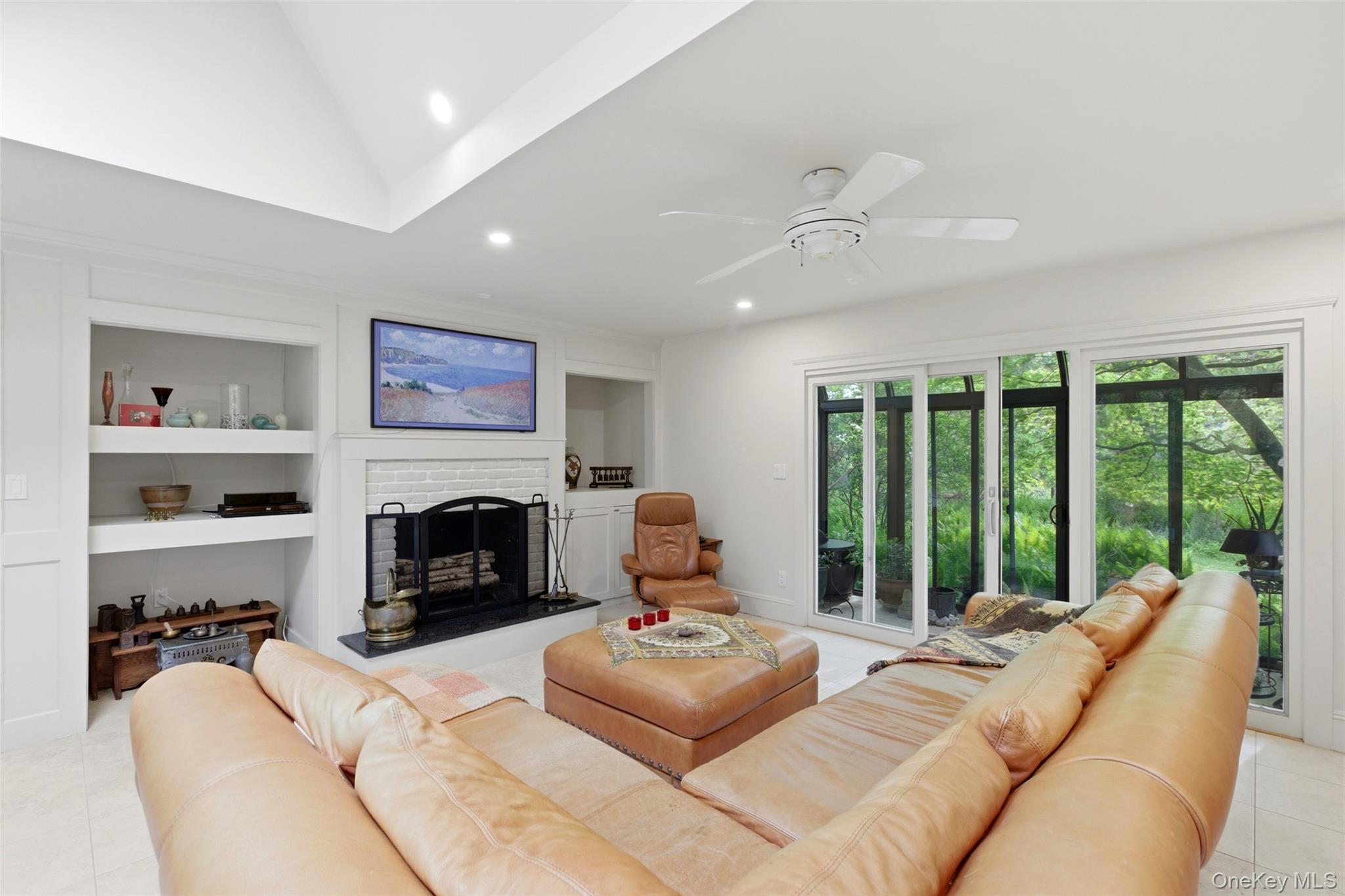 7 Gun Path Setauket, NY 11733 - Photo 10 of 34 a living room with furniture large window and fireplace