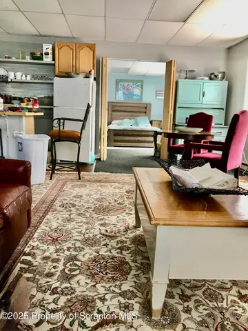 a bedroom with stove and stairs