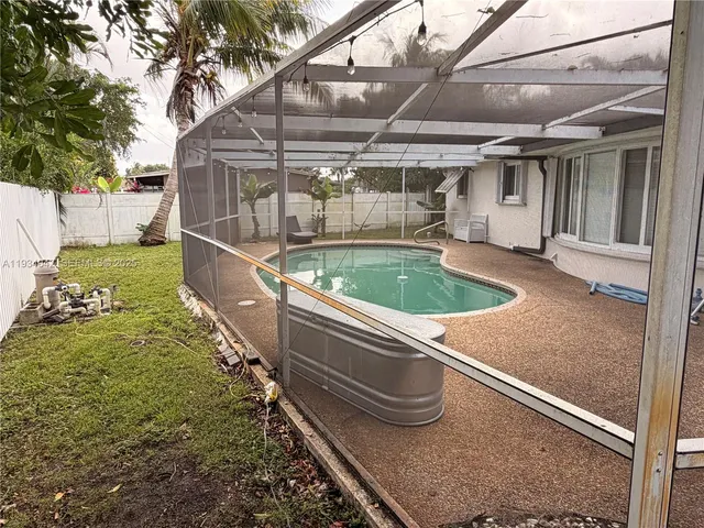 a view of outdoor space pool patio and yard