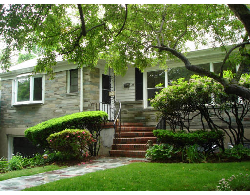 24 Helene Road Newton, MA 02468 - Photo 1 of 10 a front view of a house with a garden