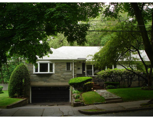 24 Helene Road Newton, MA 02468 - Photo 3 of 10 a front view of a house with a yard