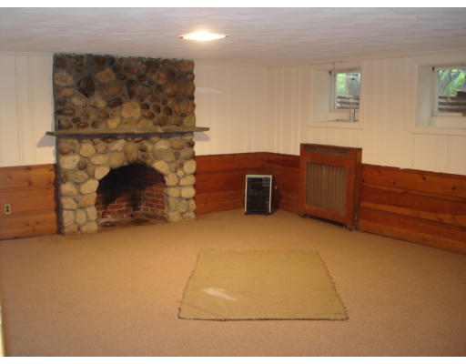 24 Helene Road Newton, MA 02468 - Photo 7 of 10 a view of a fireplace in a room