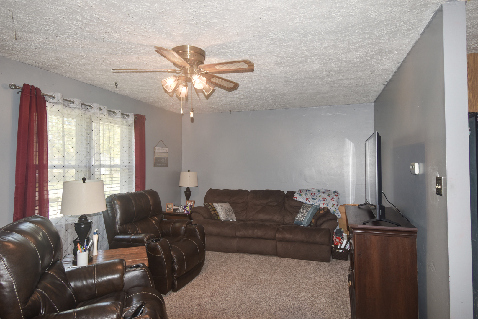 506 Boxelder Street Odell, IL 60460 - Photo 7 of 15 a living room with furniture and a large window