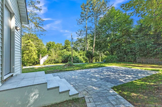 a view of a yard with an outdoor space