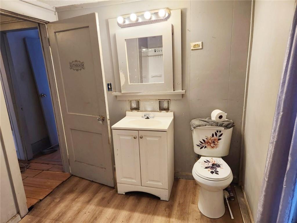 399 Baldwin Avenue Sharon, PA 16146 - Photo 17 of 23 a bathroom with a toilet a sink and a mirror