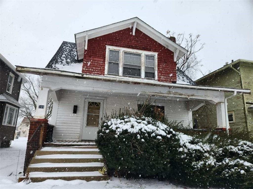 399 Baldwin Avenue Sharon, PA 16146 - Photo 2 of 23 a front view of a house with garden